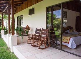 Sit comfortably outside your room at the Arenal Paraiso Hotel with a view of the Voacano