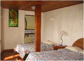 Simple, cozy rooms at Claro de Luna Hotel in Monteverde