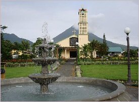 The Arenal Volcano seen from the Central Park of La Fortuna in Costa Rica