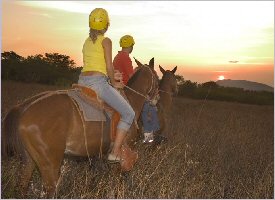 Horseback riding into the sunset in Costa Rica